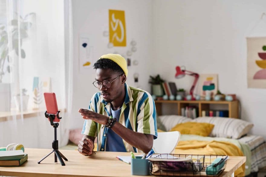 A young African creator at their desk.